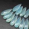 Natural Aqua Chalcedony Faceted Pear Drops Briolette Beads Sold per 2 beads pair and sizes 34mm x 12mm approx.. Chalcedony is a cryptocrystalline variety of quartz. Comes in many colors such as blue, pink, aqua. Also known to lower negative energy for healing purposes. 